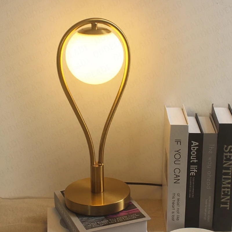 Gold - Toned Table Lamp with Milk - White Glass Shade: A Fusion of Elegance and Function