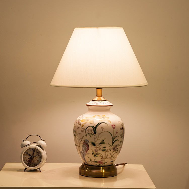 Artisanal Floral & Bird Ceramic Table Lamp: Hand-Painted Design with Fabric Shade