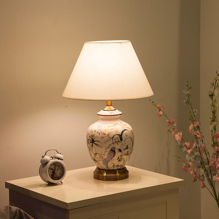 Artisanal Floral & Bird Ceramic Table Lamp: Hand-Painted Design with Fabric Shade