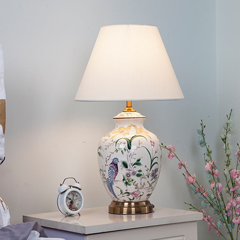 Artisanal Floral & Bird Ceramic Table Lamp: Hand-Painted Design with Fabric Shade